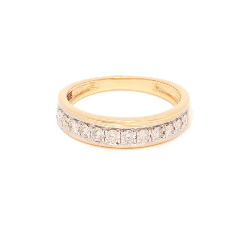Gold ring with embedded diamonds on a white background