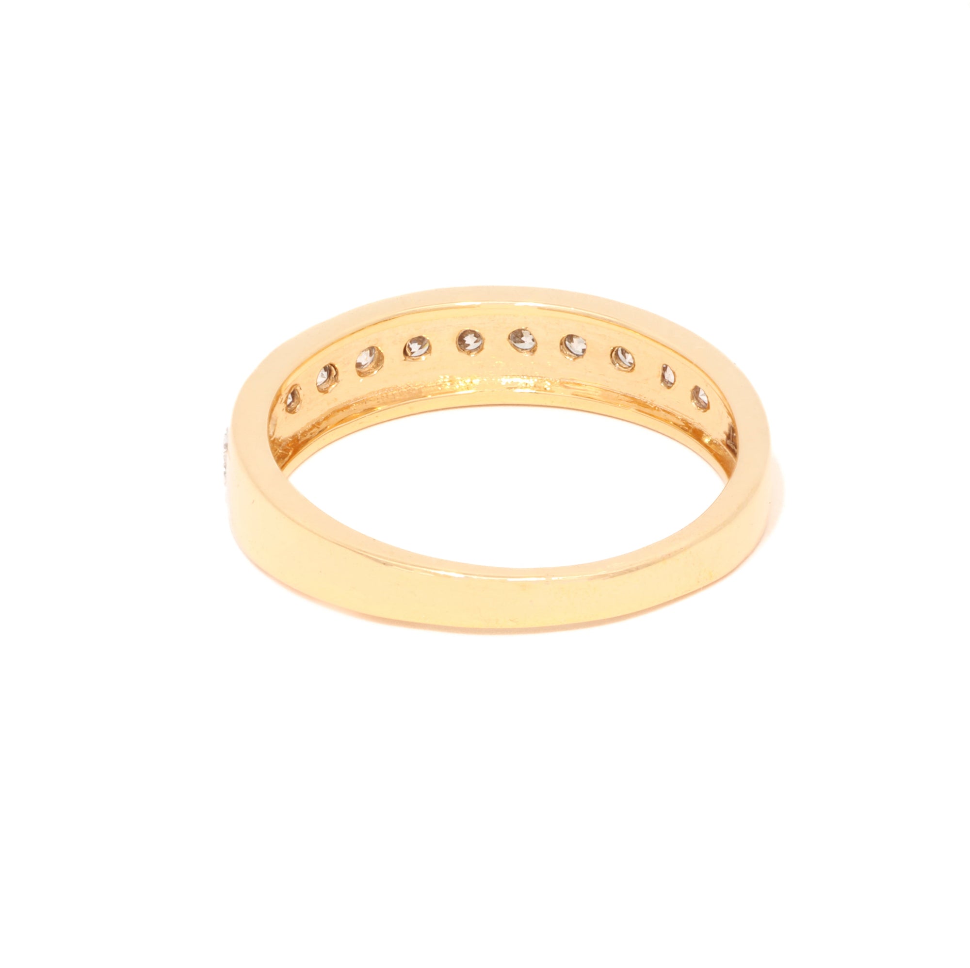 Gold ring with small diamonds on a white background
