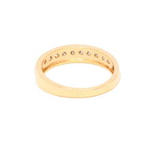 Gold ring with small diamonds on a white background