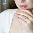 Close-up of a woman's hand with a ring.