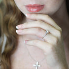 Close-up of a woman wearing a ring with a blurred background