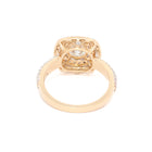 Engagement ring with a gold band on a white background