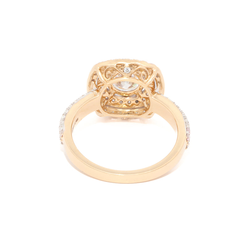 Engagement ring with a gold band on a white background