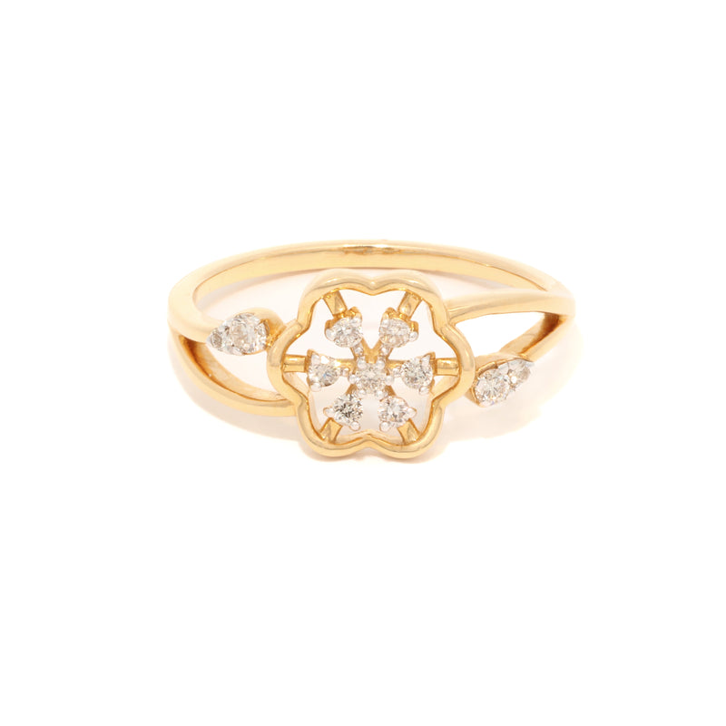 Gold ring with diamond accents on a white background