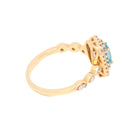 Gold ring with gemstones on a white background