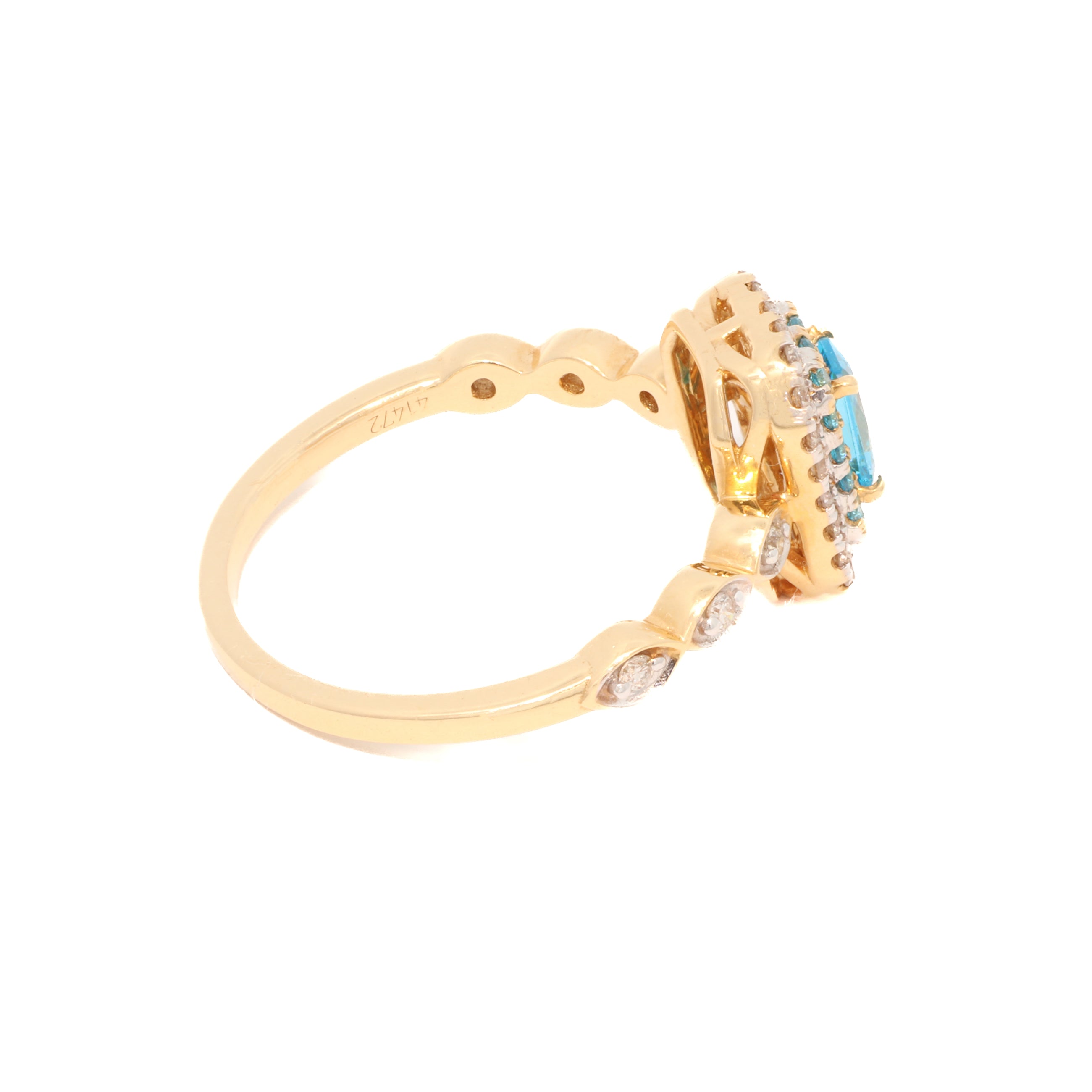 Gold ring with gemstones on a white background