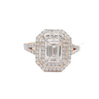 Diamond ring with a rectangular center stone on a white background