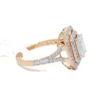 Yellow gold ring with diamond accents on a white background