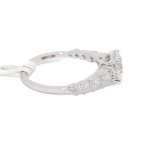 Diamond ring with a white gold band on a white background