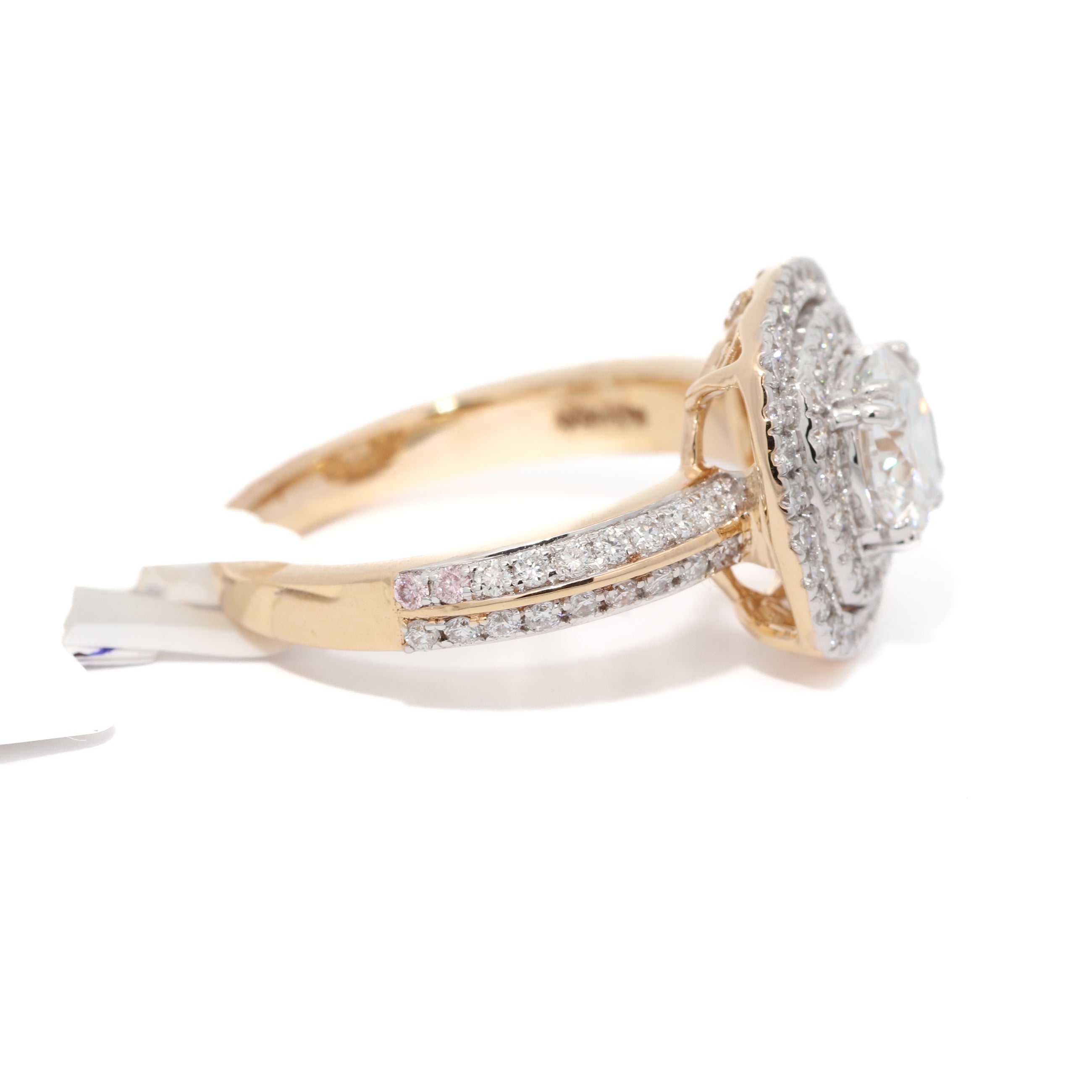 Gold and diamond ring on a white background
