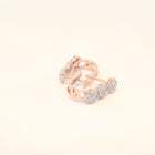 Rose gold hoop huggies with natural diamonds