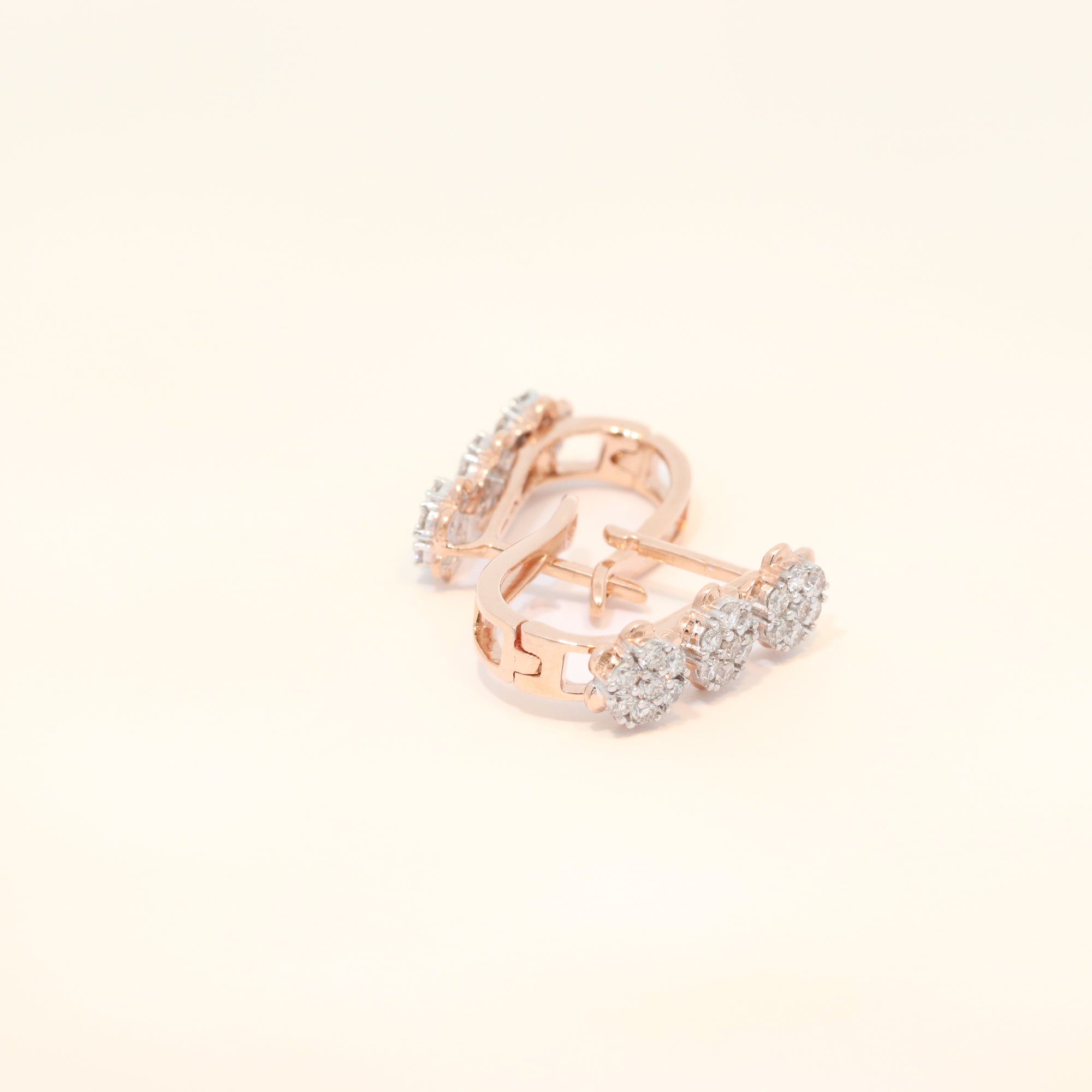 Rose gold hoop huggies with natural diamonds