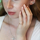 The Fleur Diamond Ring in Gold and Diamonds on hand.