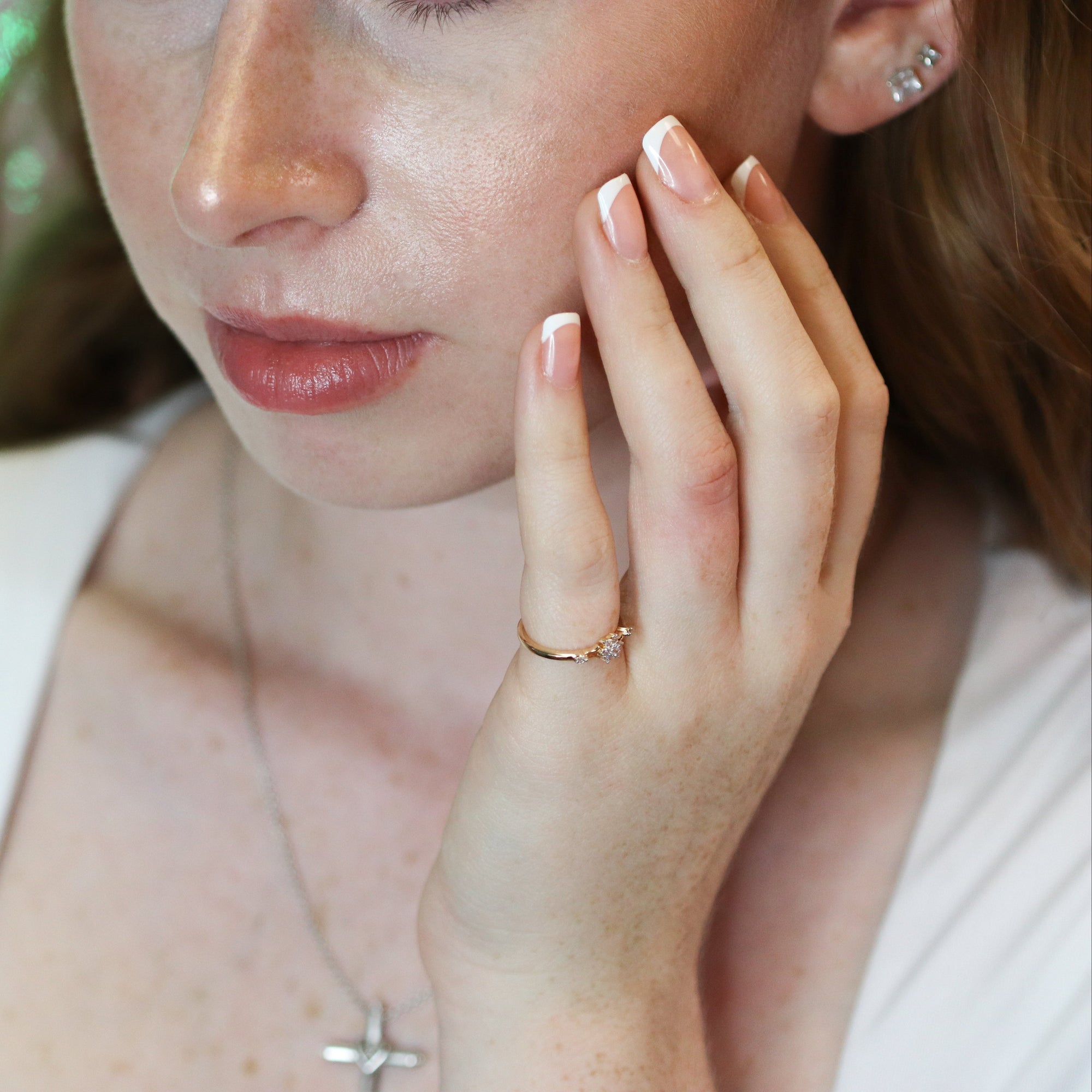 The Fleur Diamond Ring in Gold and Diamonds on hand.