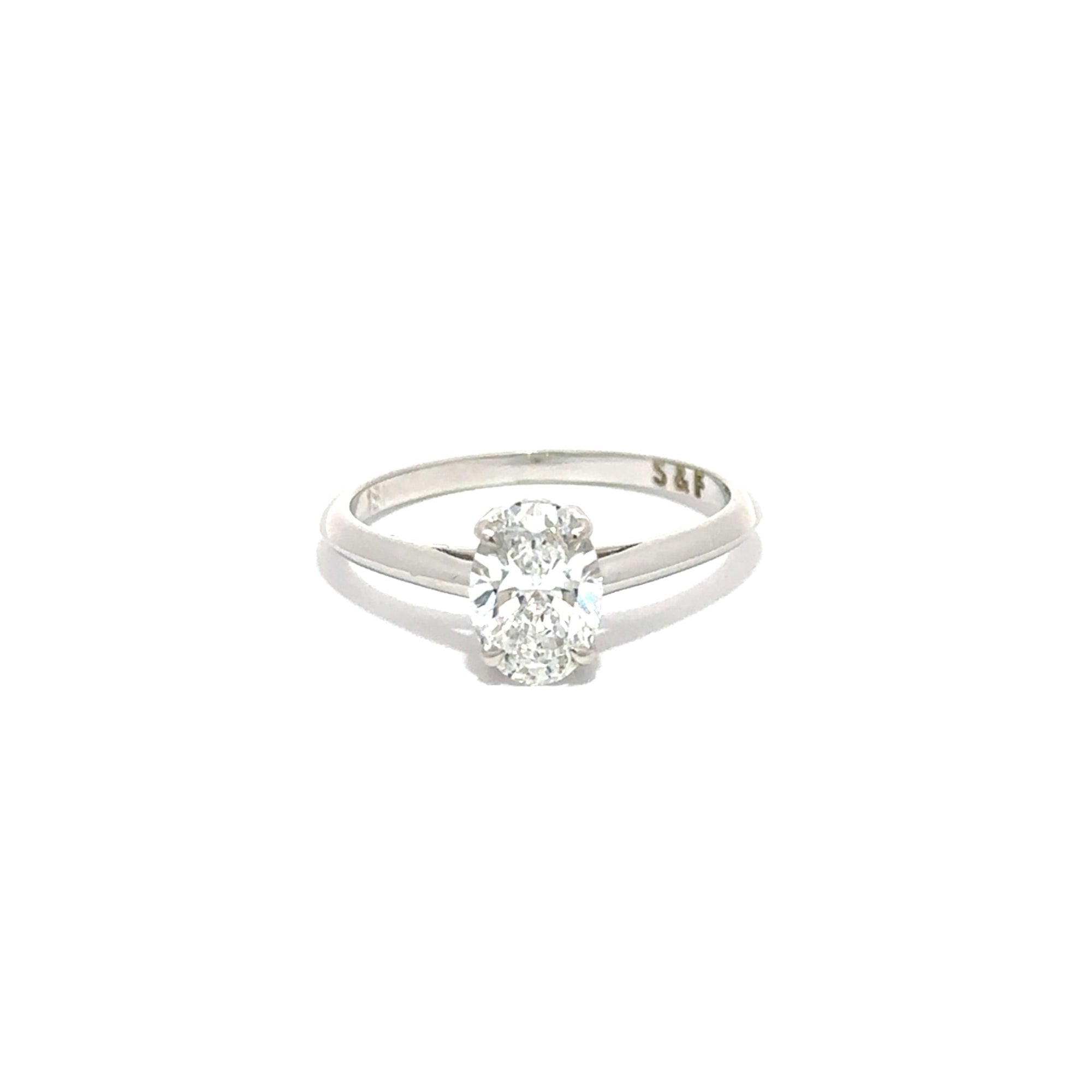 white gold ring with a diamond on a white background