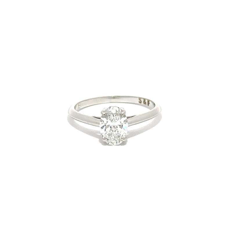 white gold ring with a diamond on a white background