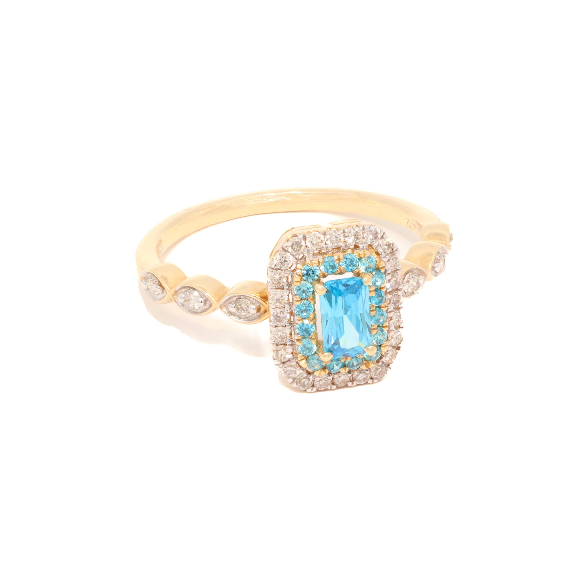 Gold ring with a blue gemstone and diamond accents on a white background