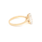 Yellow Gold ring with a lab created radiant diamond on a white background